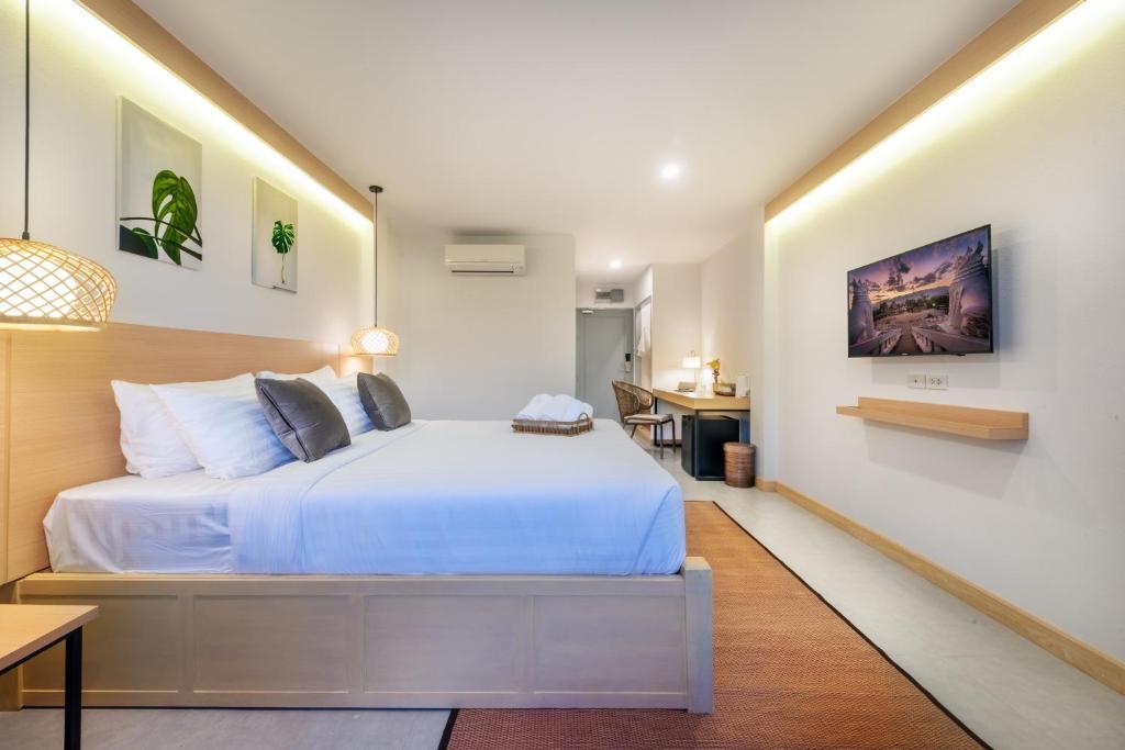 Postel nebo postele na pokoji v ubytování Ai Pai Hotel