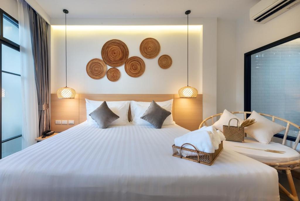 Postel nebo postele na pokoji v ubytování Ai Pai Hotel