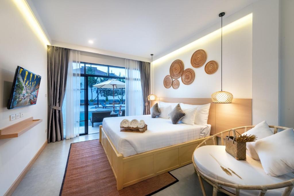 Postel nebo postele na pokoji v ubytování Ai Pai Hotel