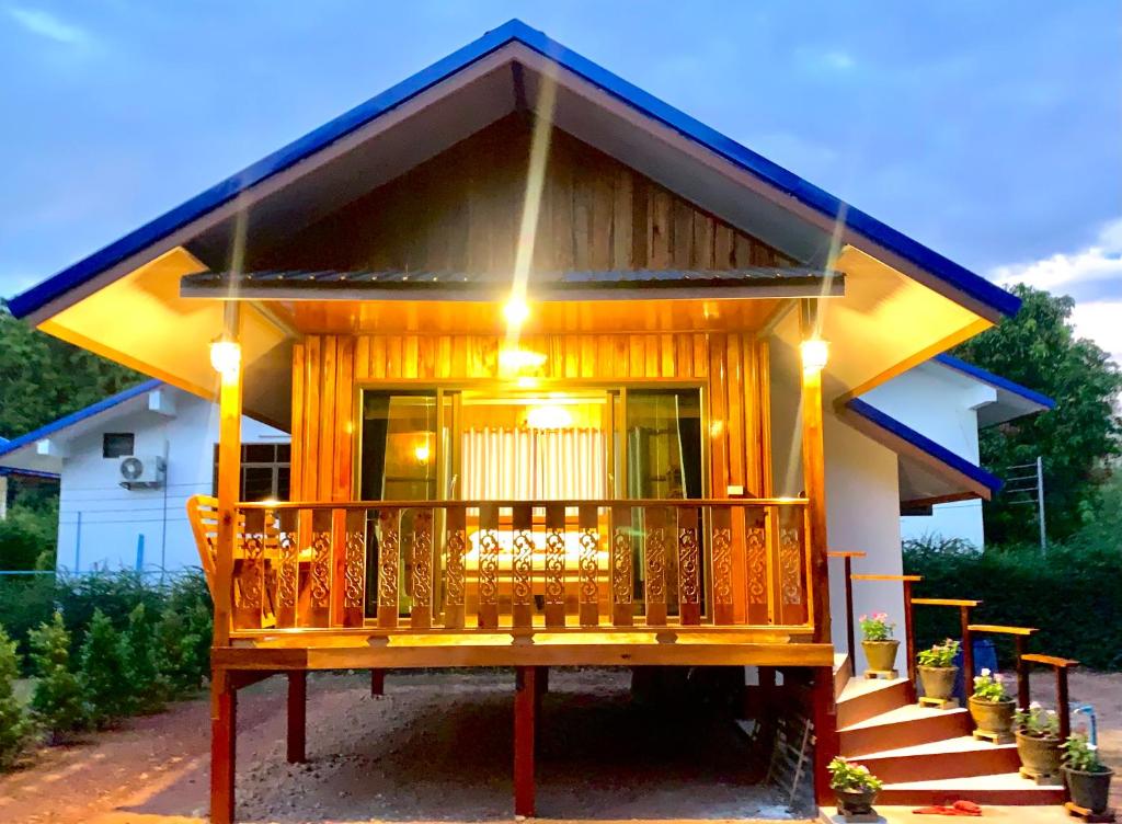 a small house with a large wooden deck at Koh Jum Paradise Resort in Ko Jum