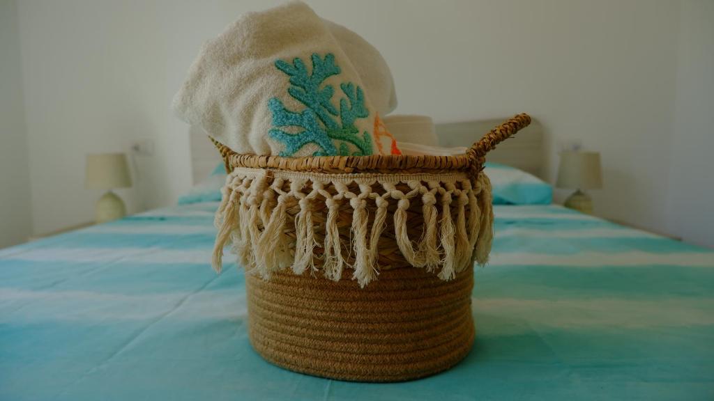 En eller flere senge i et værelse på Villetta La Caletta