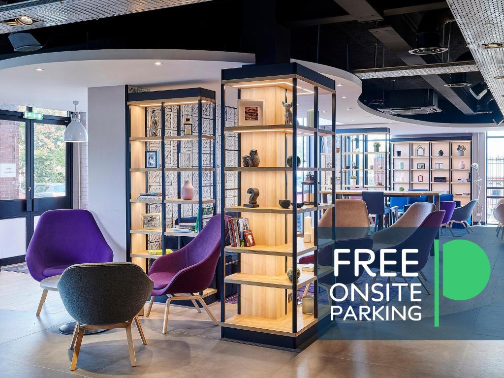 a store with purple chairs and a sign for free outside parking at Campanile Hotel - Birmingham in Birmingham