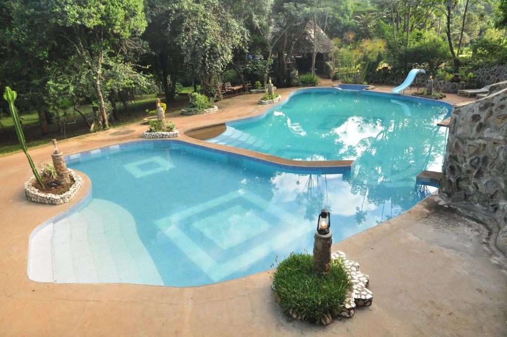 an overhead view of a large swimming pool at Naiberi River Campsite & Resort in Eldoret