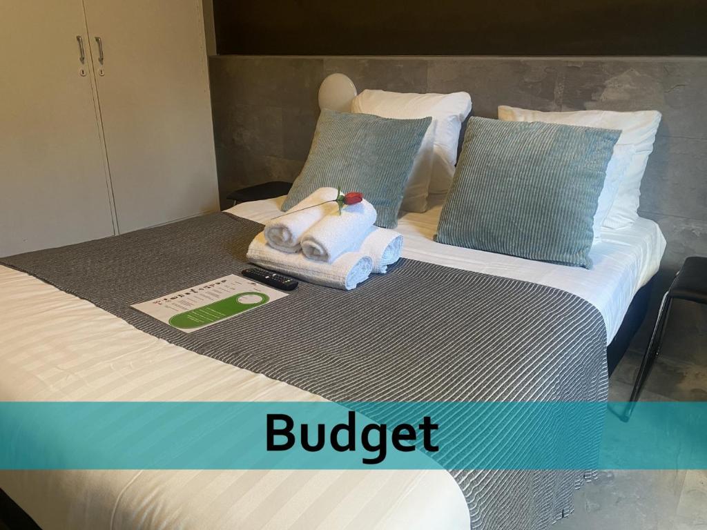 Postel nebo postele na pokoji v ubytování Grand Hotel Central