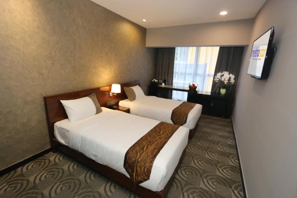 เตียงในห้องที่ Metrostar Hotel Kuala Lumpur