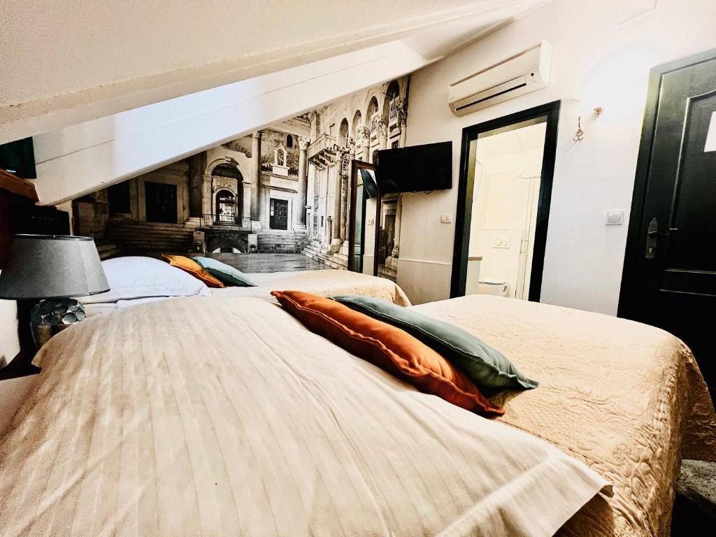 Postel nebo postele na pokoji v ubytování Hotel Villa Diana