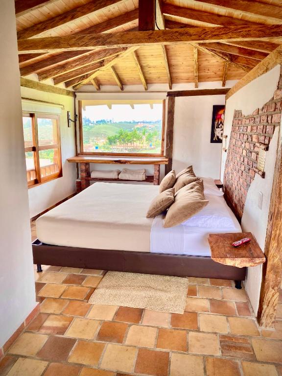 Llit o llits en una habitació de Hotel Boutique Santa Clara Mesa de los Santos