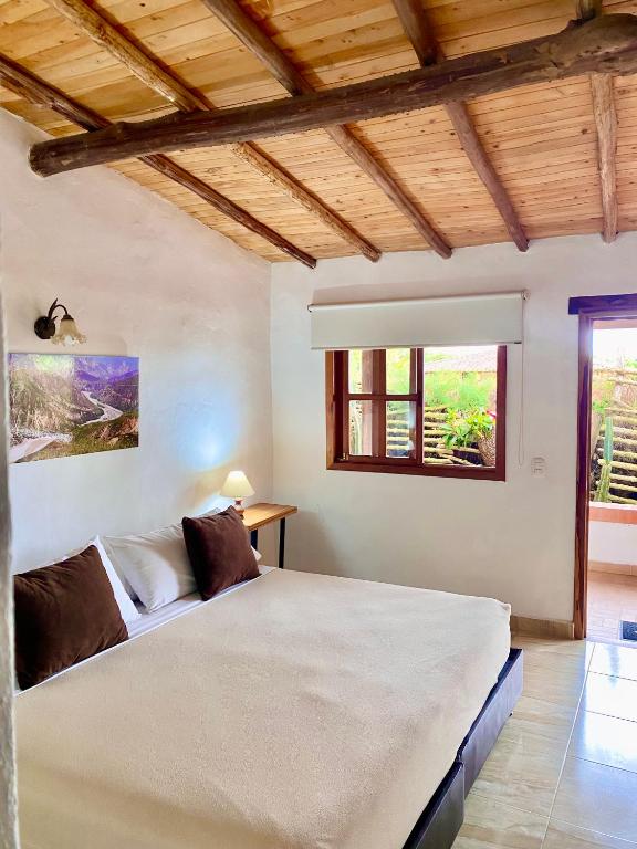 Llit o llits en una habitació de Hotel Boutique Santa Clara Mesa de los Santos
