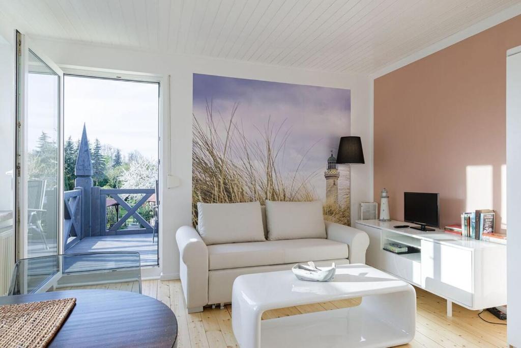 TV a/nebo společenská místnost v ubytování Hafenhaus Leuchtturm