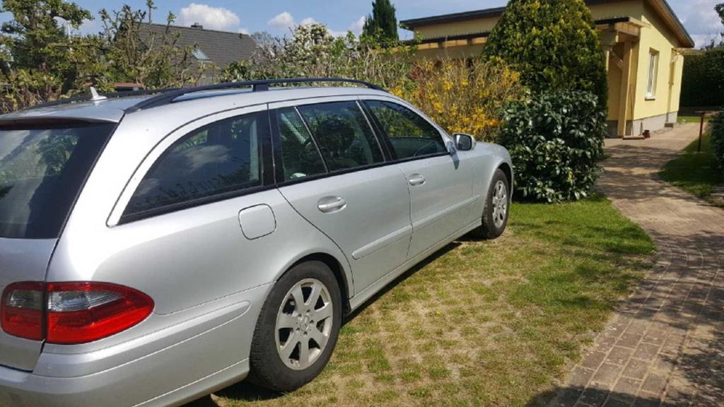 a silver car parked in the driveway of a house at FH Wendorff in Klink