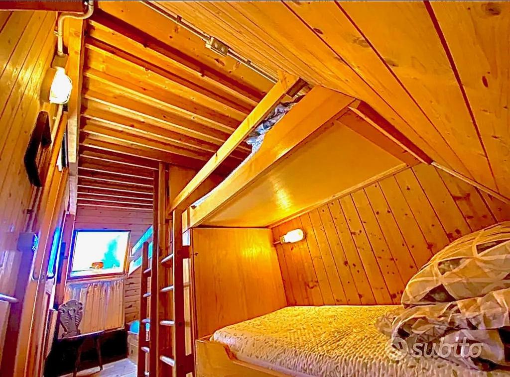 Televízia a/alebo spoločenská miestnosť v ubytovaní ~Chalet_Rifugio tra i boschi~