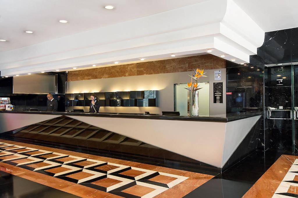 The main reception desk has a polished, formal hotel-lobby finish.
