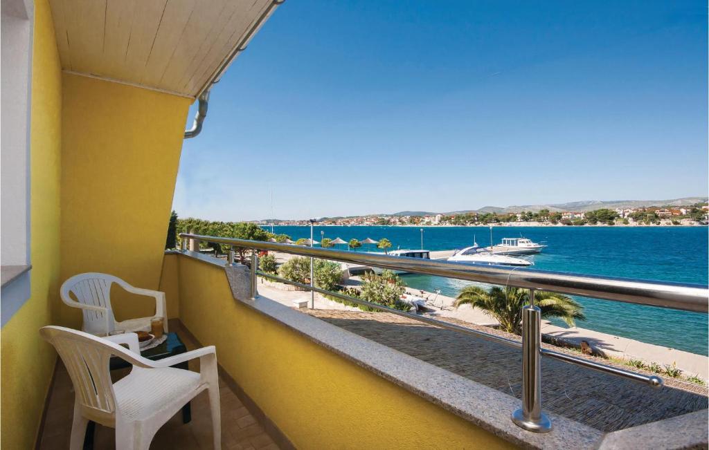 a balcony with a view of the water at Cozy Apartment In Sibenik With House Sea View in Krapanj