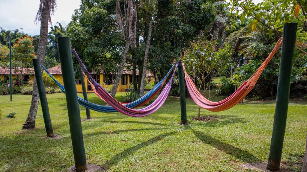 a couple of hammocks in a park at Hotel Fazenda Bela Vista in Dourado
