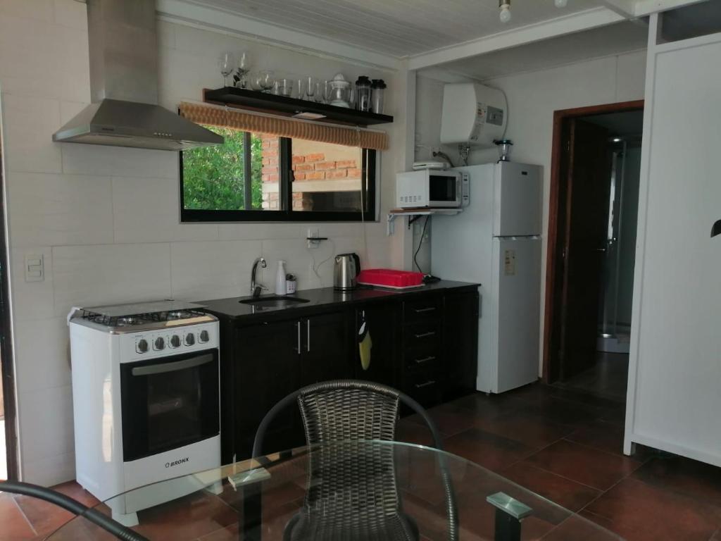 Kuchyň nebo kuchyňský kout v ubytování Aroma de mar casas en alquiler vacacional con hermosa piscina