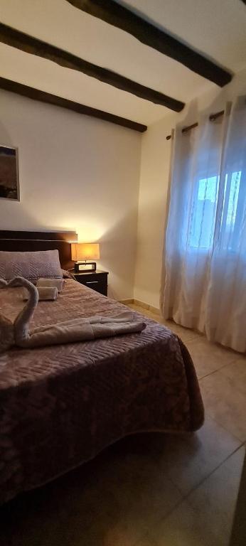 Postel nebo postele na pokoji v ubytování CA.MARCELA. 200 metros del mar.