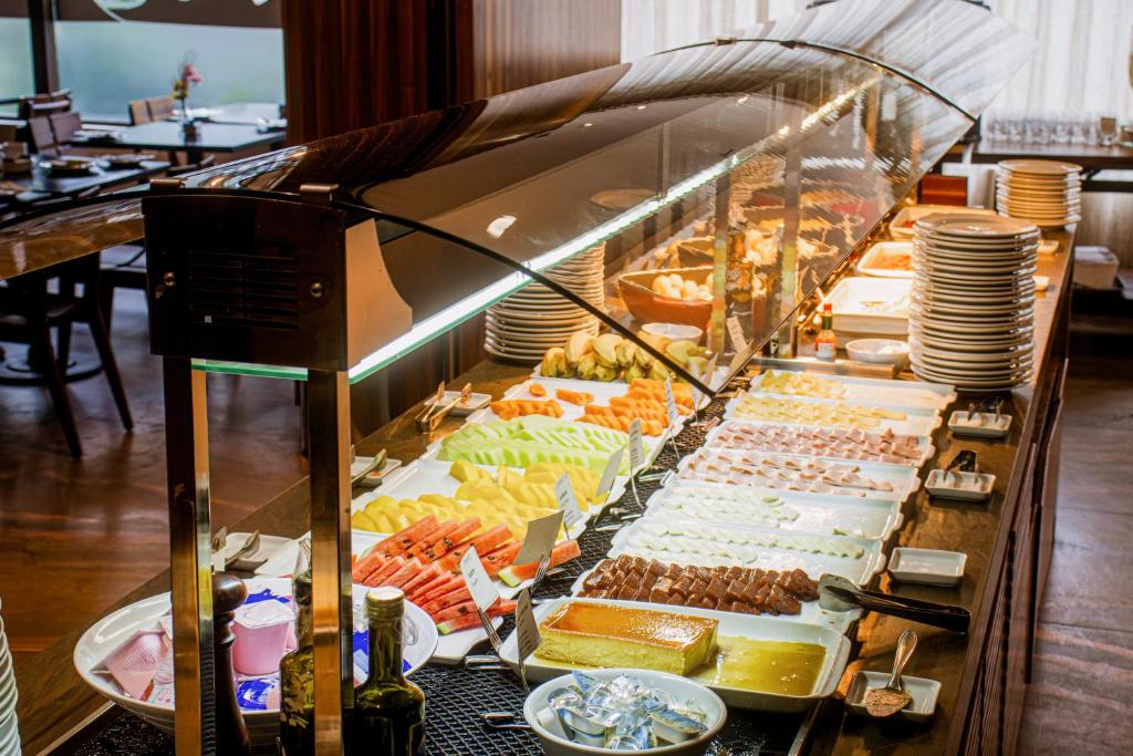 a buffet line with many different types of food at Arena Ipanema Hotel in Rio de Janeiro