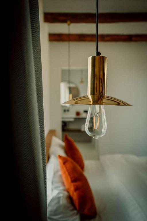Postel nebo postele na pokoji v ubytování Relais M B&B