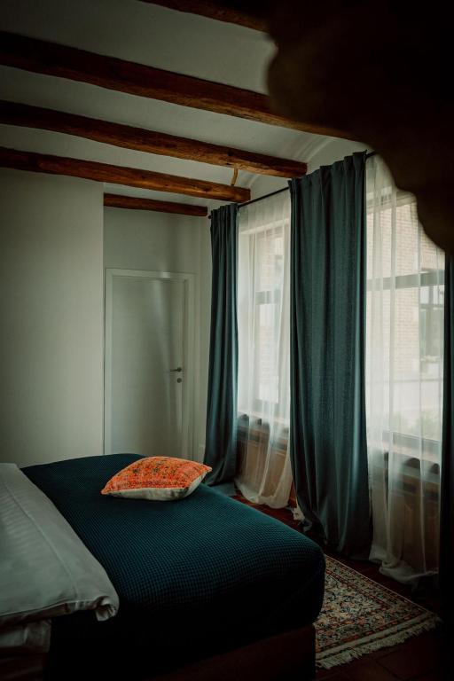 Postel nebo postele na pokoji v ubytování Relais M B&B