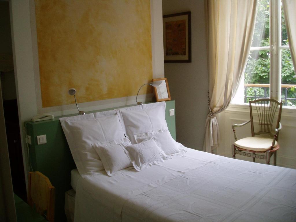 Postel nebo postele na pokoji v ubytování Hotel Le Clos Raymi