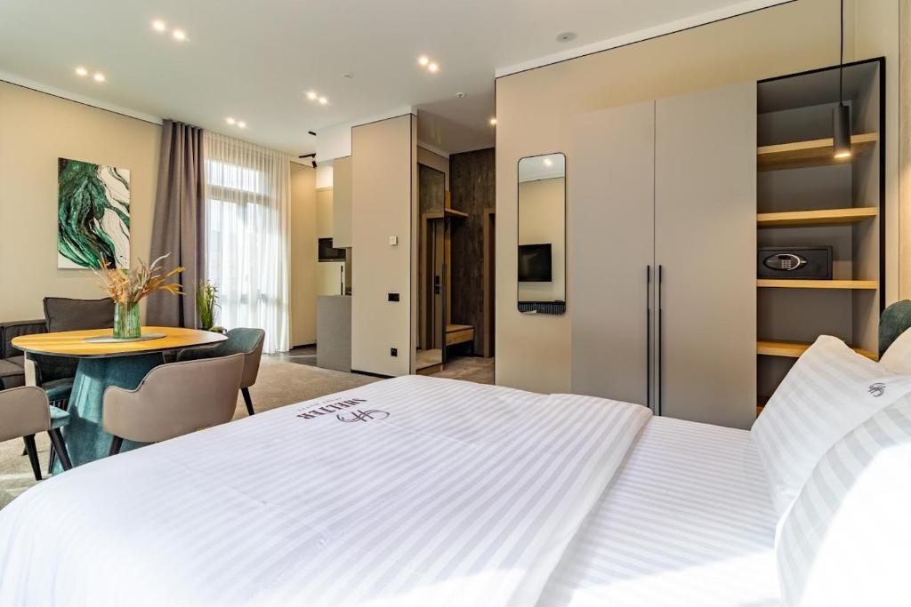 Postel nebo postele na pokoji v ubytování Shelter Apart Hotel