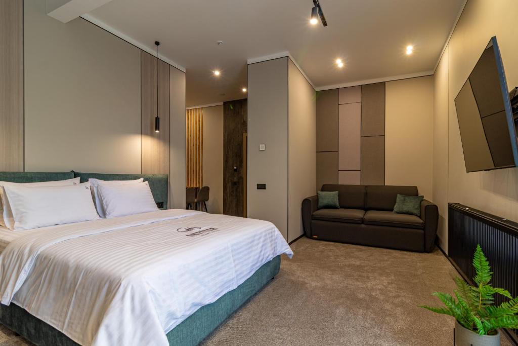 Postel nebo postele na pokoji v ubytování Shelter Apart Hotel