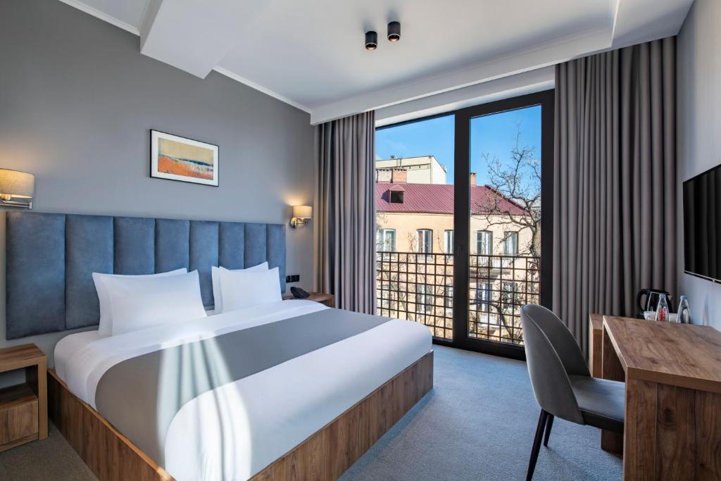 Postel nebo postele na pokoji v ubytování Barnovi Boutique Hotel