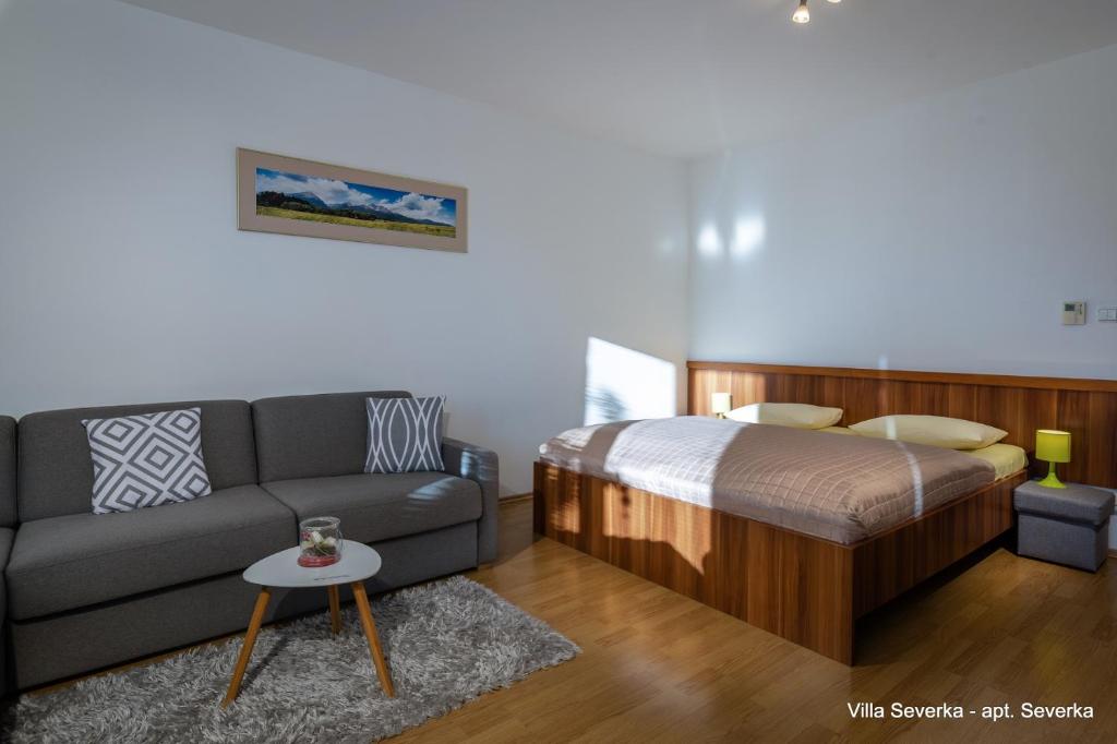 Postel nebo postele na pokoji v ubytování Apartmány Villa Severka