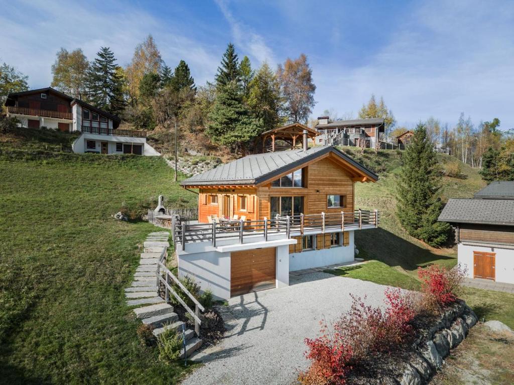 a house on the side of a hill at Chalet Amerhone - Luxury chalet With Jacuzzi in Riddes