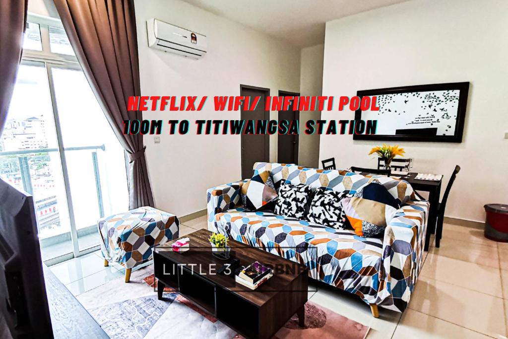 a living room with a couch and a table at 3R2B Near Titiwangsa Station PWTC HKL KLCC IJM TRA115 in Kuala Lumpur