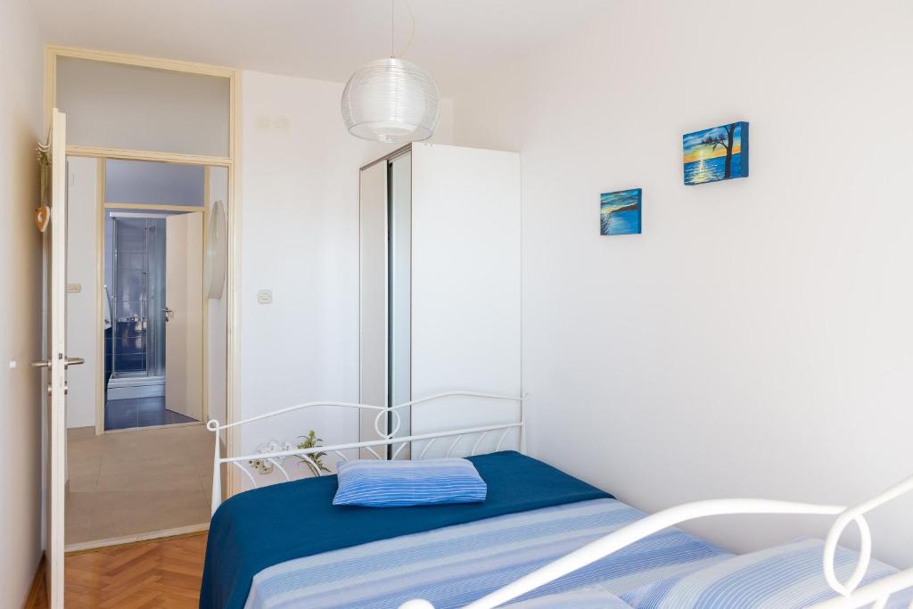 Posteľ alebo postele v izbe v ubytovaní Bounty Apartment