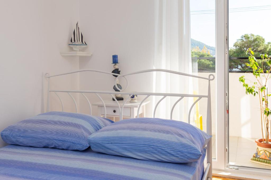 Posteľ alebo postele v izbe v ubytovaní Bounty Apartment