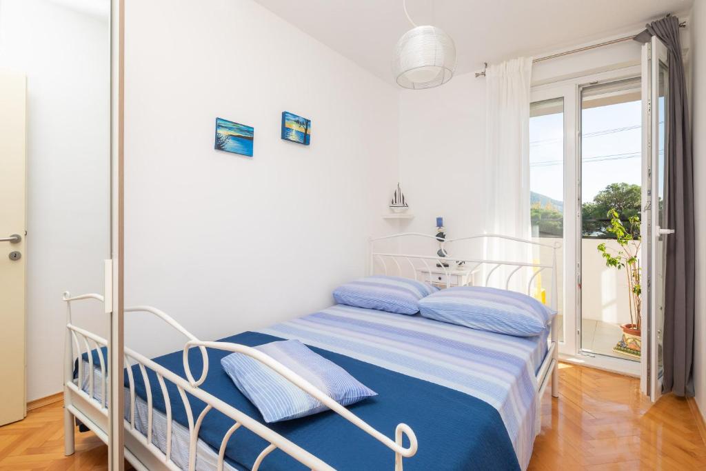 Posteľ alebo postele v izbe v ubytovaní Bounty Apartment
