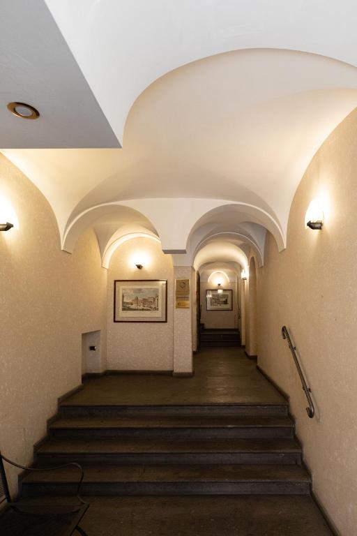 a long hallway with stairs in an old building at Relais Roma Centro in Rome