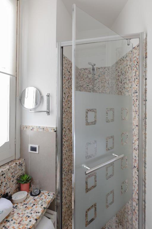 a shower with a glass door in a bathroom at Relais Roma Centro in Rome