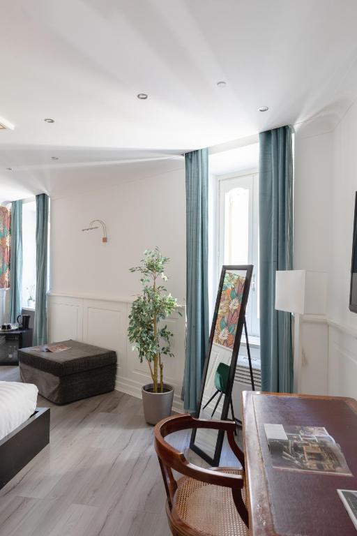 a living room with a couch and a table at Relais Roma Centro in Rome