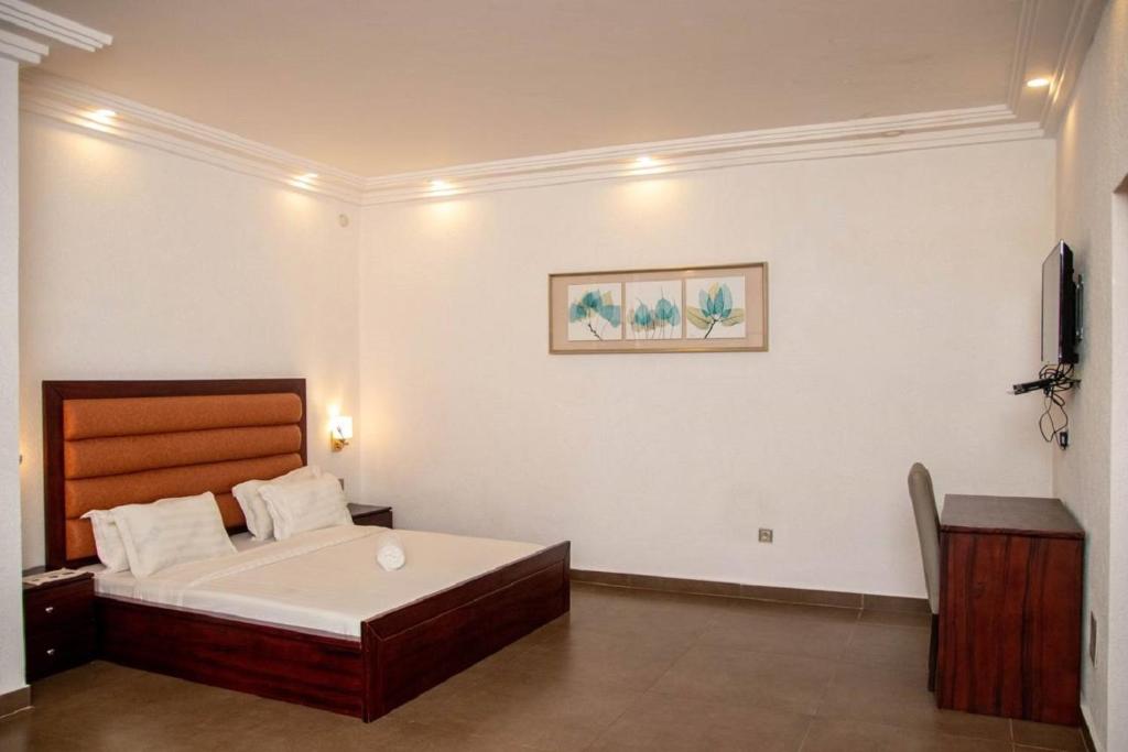 Postel nebo postele na pokoji v ubytování Hôtel Guest House Quatre Saisons