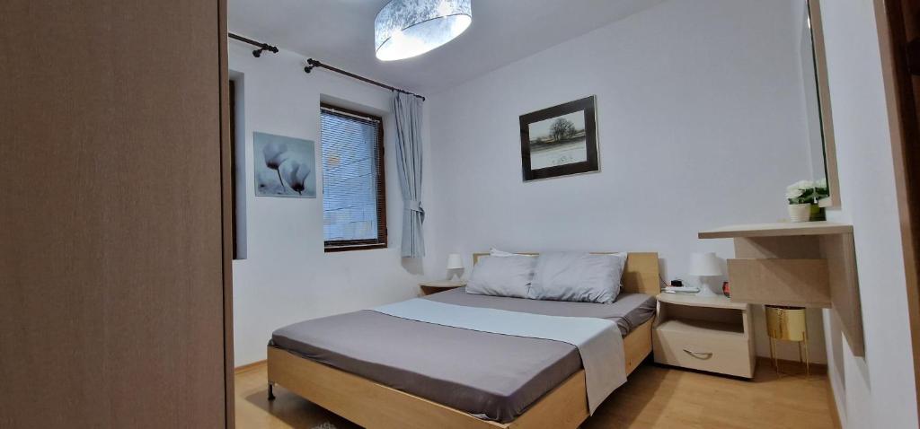 A bed or beds in a room at NordenPamporovo