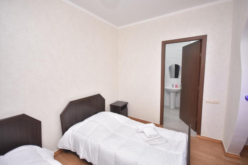 Postel nebo postele na pokoji v ubytování HOTEL SAMEGRELO