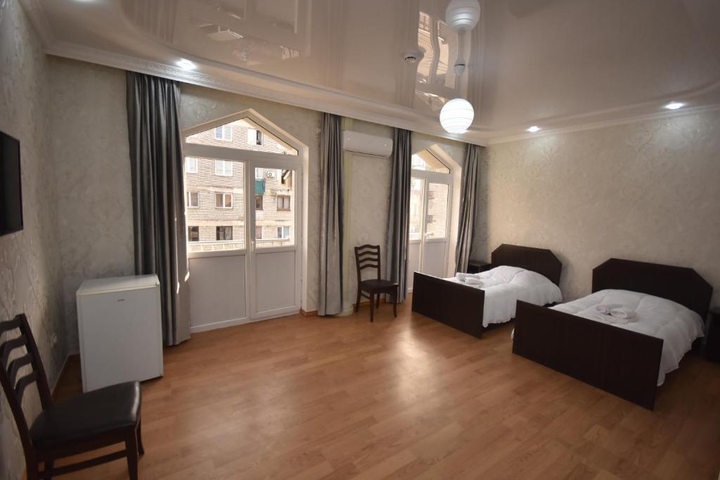 Postel nebo postele na pokoji v ubytování HOTEL SAMEGRELO