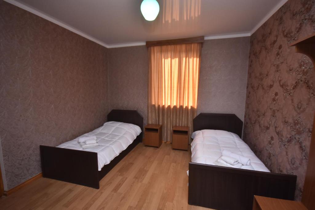 Postel nebo postele na pokoji v ubytování HOTEL SAMEGRELO