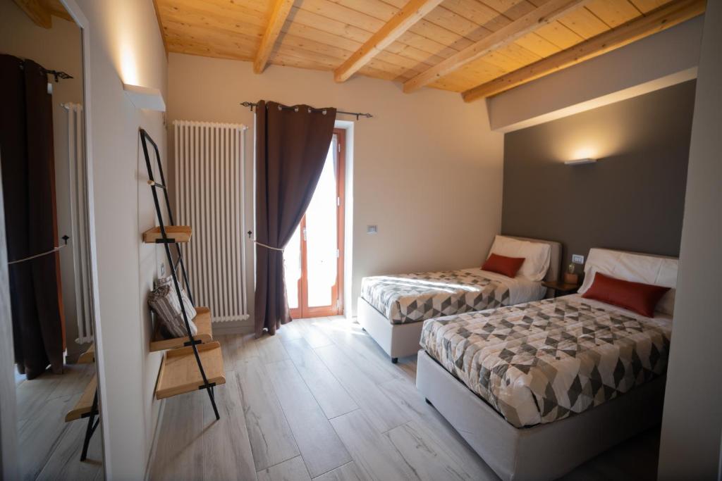 Postel nebo postele na pokoji v ubytování BuonVivere House