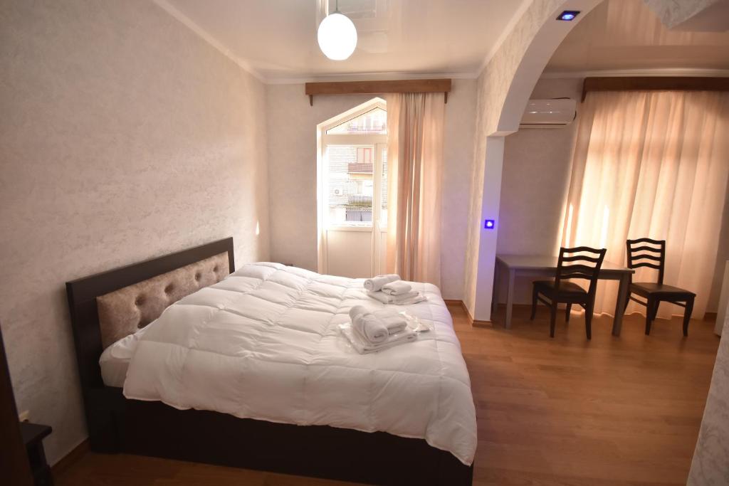 Postel nebo postele na pokoji v ubytování HOTEL SAMEGRELO