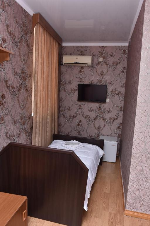 Postel nebo postele na pokoji v ubytování HOTEL SAMEGRELO
