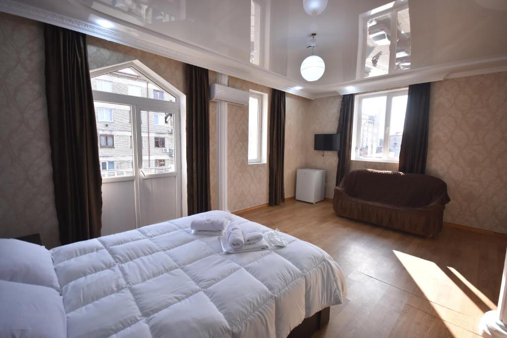 Postel nebo postele na pokoji v ubytování HOTEL SAMEGRELO
