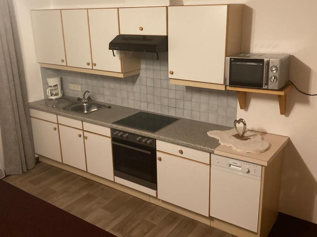 Kuchyň nebo kuchyňský kout v ubytování Garni Apart Wallamotta Silvretta Card Premium Betrieb