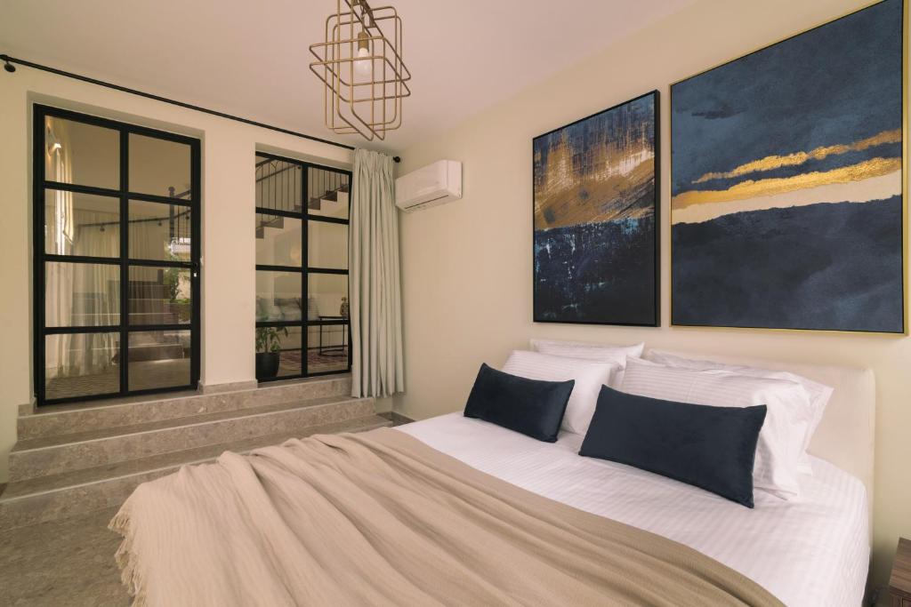 Postel nebo postele na pokoji v ubytování Kaletzia villas
