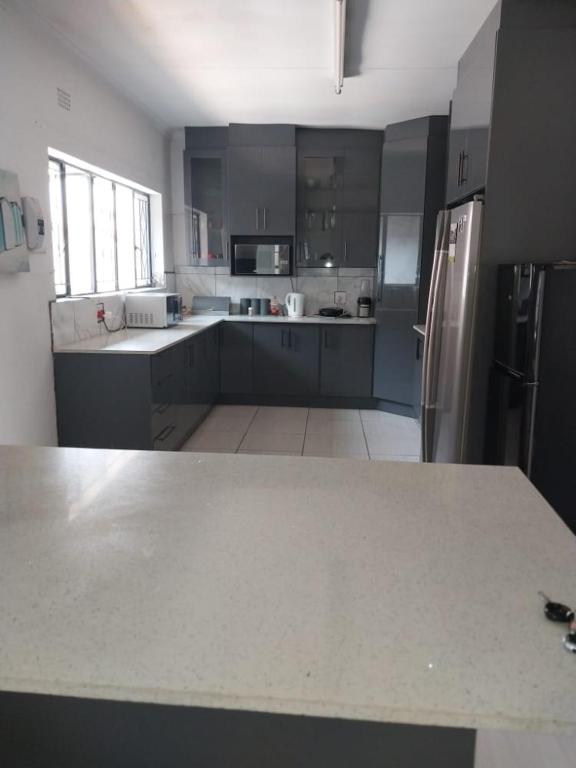 a kitchen with a white counter top in a room at Vaal holiday home in Vanderbijlpark