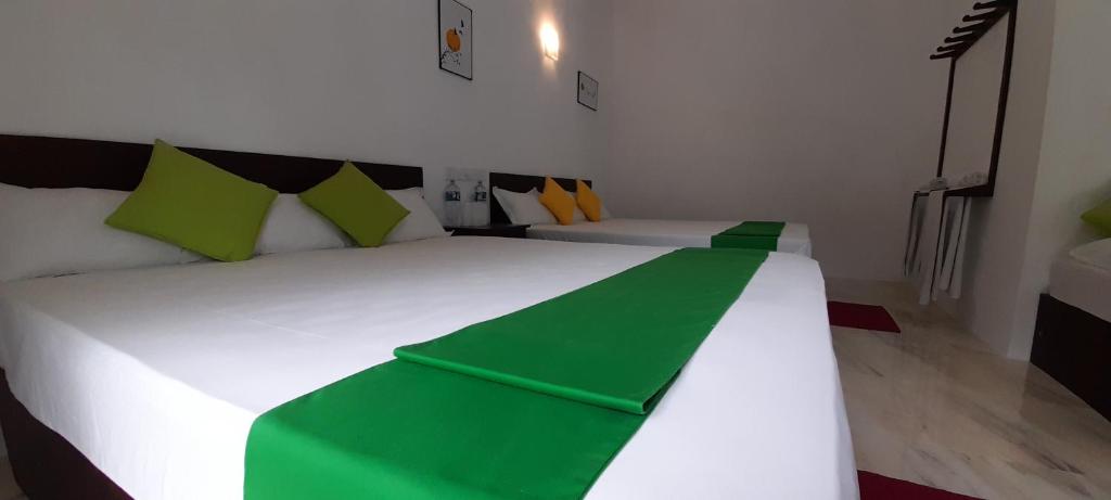 Postel nebo postele na pokoji v ubytování Senomaal Sigiri Resort