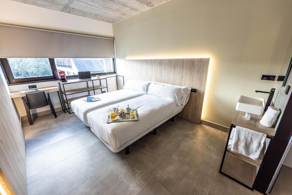 Postel nebo postele na pokoji v ubytování Hospedium Hotel Devalar Do Mar